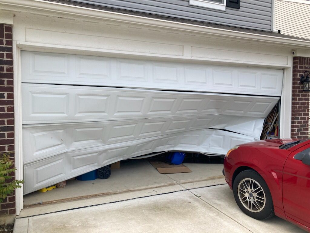 Garage door hit by a car