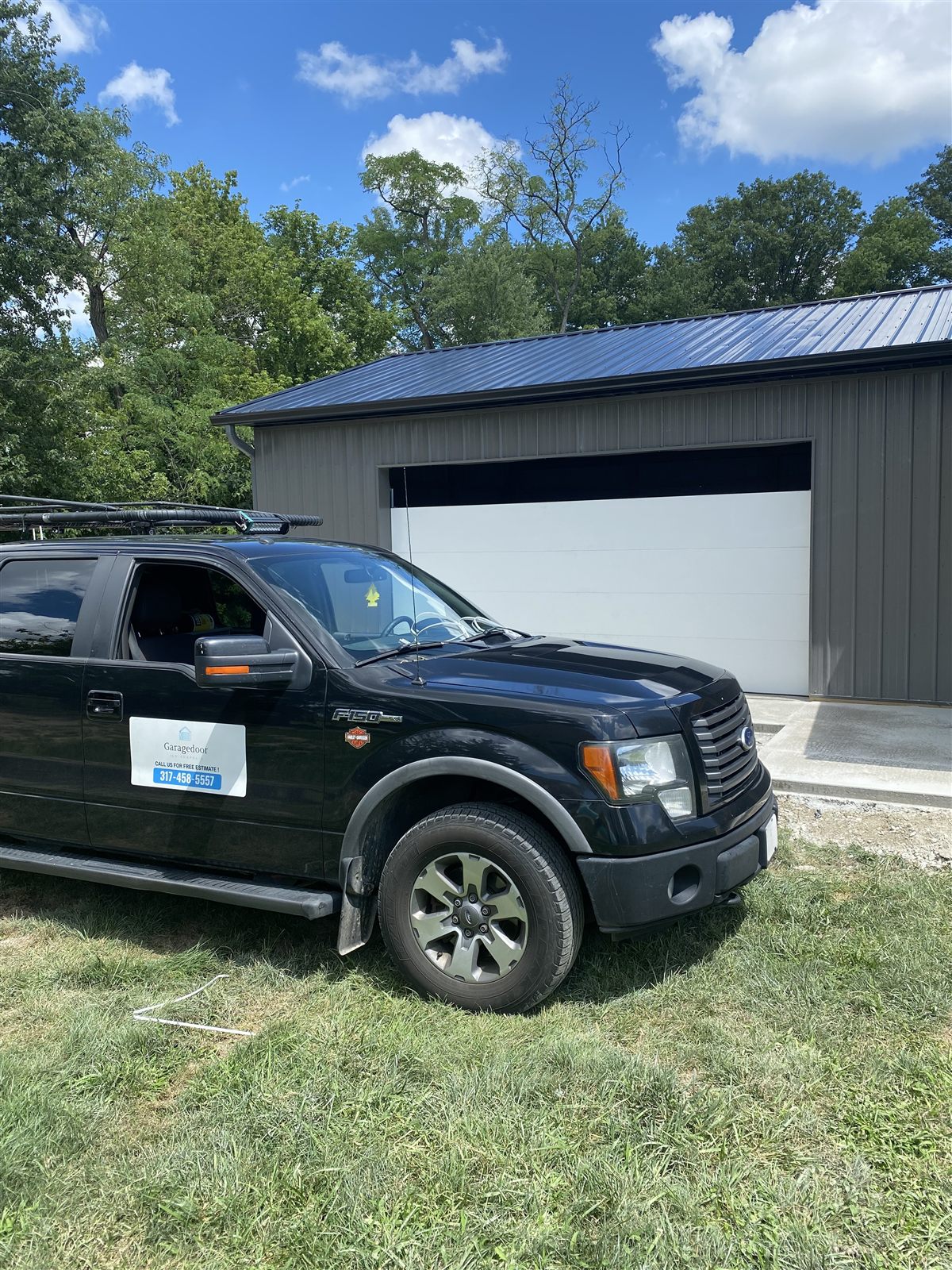 Garage Door Indianapolis truck on-site at a pole barn